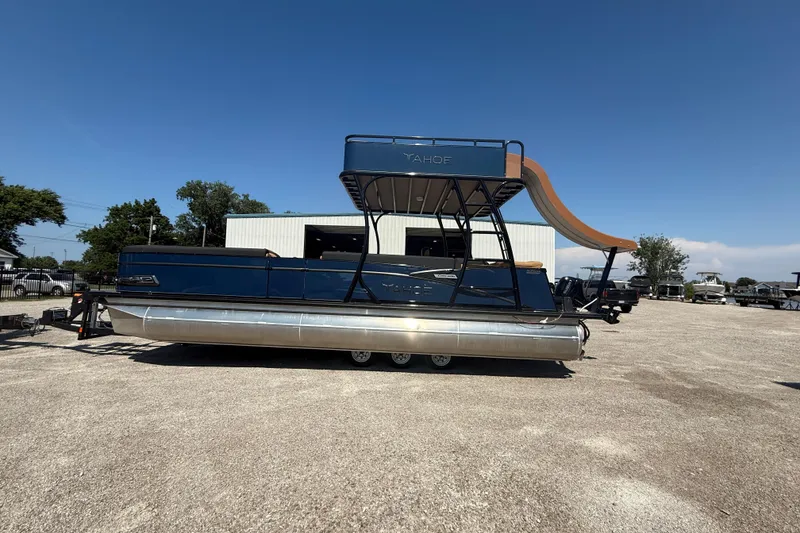 Slide: The Image of 2025 Tahoe Pontoon Cascade Cruise Funship with slide, parked outdoors under clear sky. - 21