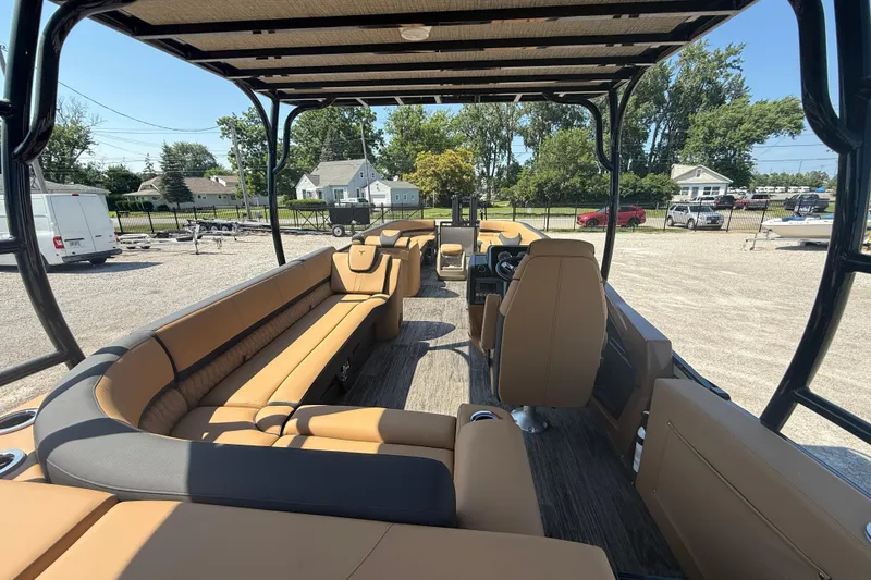 Slide: The Image of 2025 Tahoe Pontoon Cascade Cruise Funship interior with tan seating and open deck layout. - 8