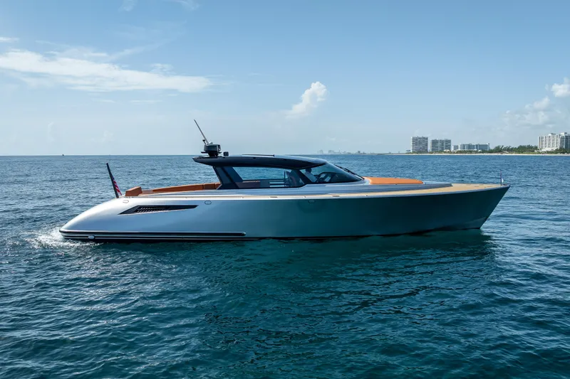 Slide: The Image of 2024 Wajer 55 HT luxury yacht cruising on open water under a clear sky. - 11