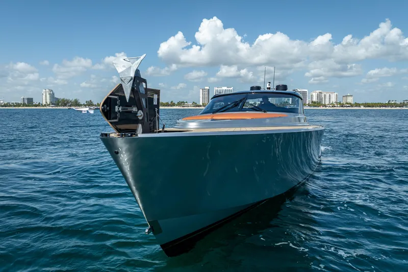 Slide: The Image of 2024 Wajer 55 HT yacht on open water, city skyline in background. - 19