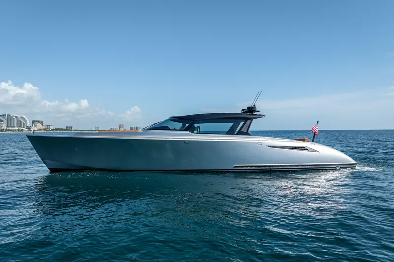 Slide: The Image of 2024 Wajer 55 HT yacht cruising on open water under clear blue skies. - 2