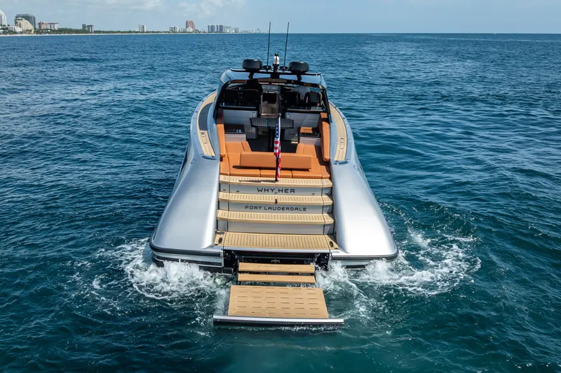 Slide: The Image of 2024 Wajer 55 HT yacht cruising in open water, rear view with city skyline. - 23