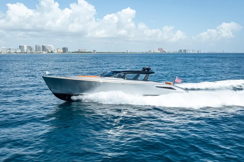 Slide: The Image of 2024 Wajer 55 HT yacht cruising on ocean with city skyline in background. - 31