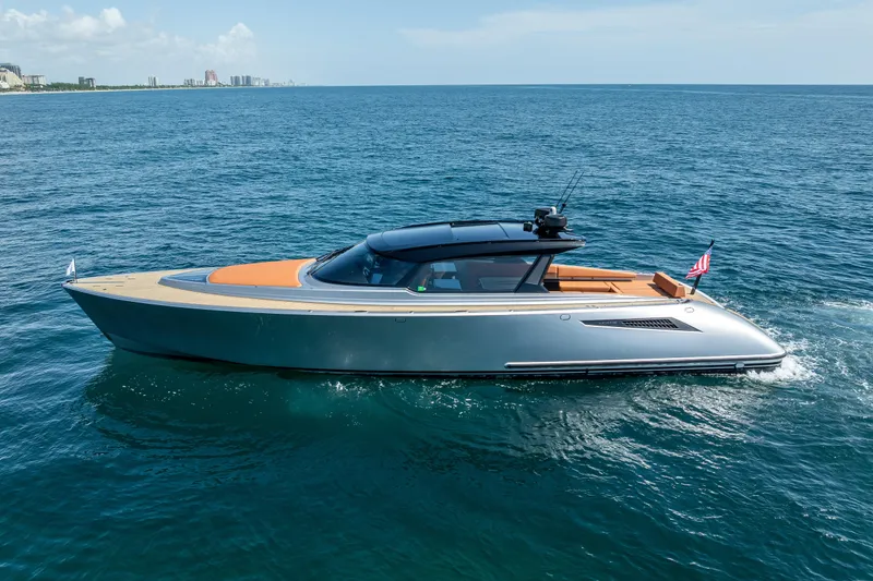Slide: The Image of 2024 Wajer 55 HT luxury yacht cruising on open sea under clear skies. - 4