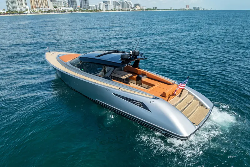 Slide: The Image of 2024 Wajer 55 HT luxury yacht cruising on open water near city skyline. - 5