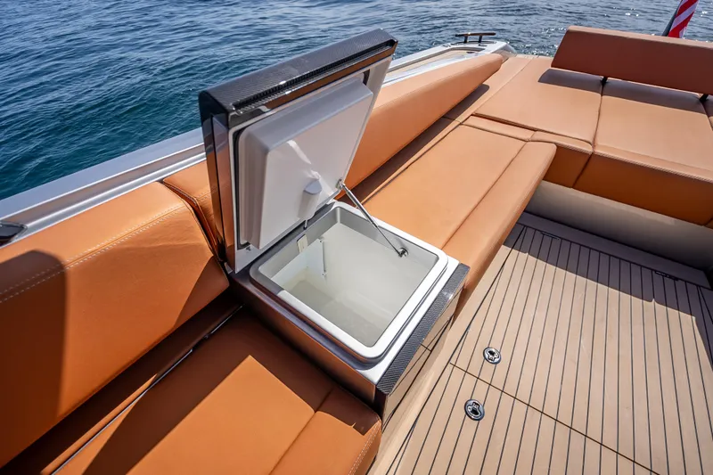 Slide: The Image of 2024 Wajer 55 HT yacht with open storage compartment on deck, featuring tan seating. - 57