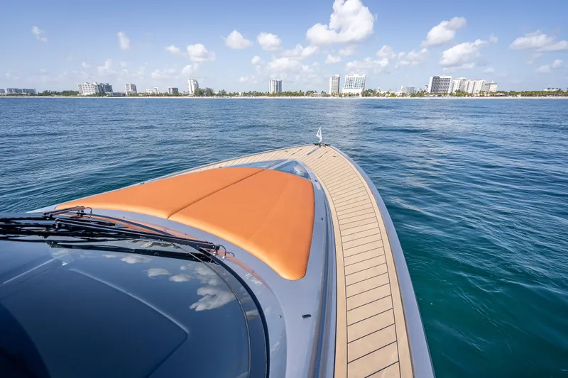 Slide: The Image of 2024 Wajer 55 HT yacht cruising on calm ocean with city skyline in background. - 63