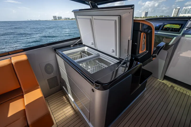 Slide: The Image of Luxury interior of 2024 Wajer 55 HT yacht with open refrigerator, ocean view. - 69