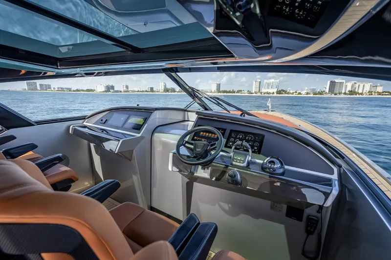 Slide: The Image of Luxurious 2024 Wajer 55 HT yacht cockpit with modern controls, overlooking a coastal cityscape. - 80