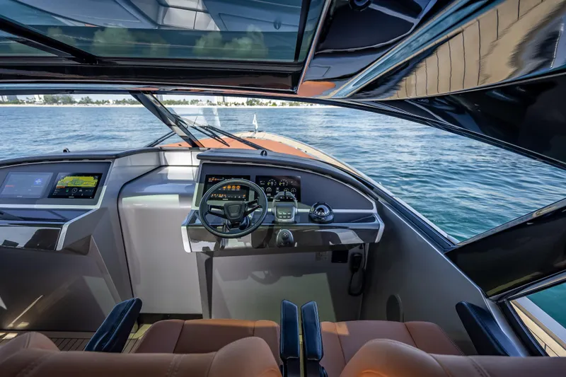 Slide: The Image of Interior view of 2024 Wajer 55 HT yacht cockpit with modern controls and ocean backdrop. - 81