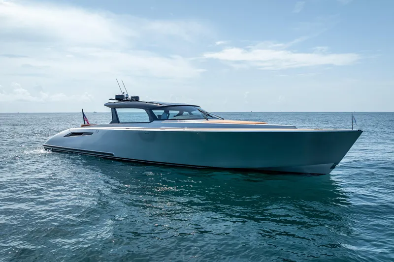 Slide: The Image of 2024 Wajer 55 HT luxury yacht cruising on open water under clear skies. - 9