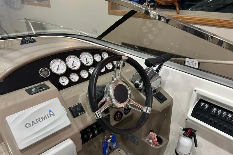 Slide: The Image of 2017 Regal 30 Express boat dashboard with Garmin navigation and control instruments. - 7