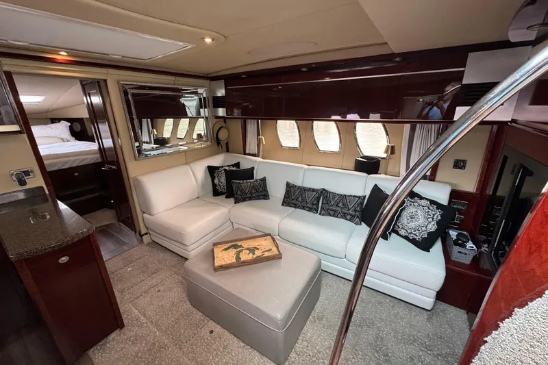 Slide: The Image of Luxurious interior of 2007 Sea Ray 48 Sundancer yacht with white leather seating and elegant decor. - 29