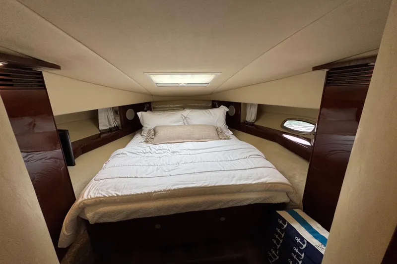 Slide: The Image of Luxurious cabin interior of 2007 Sea Ray 48 Sundancer yacht with cozy bed and elegant decor. - 31