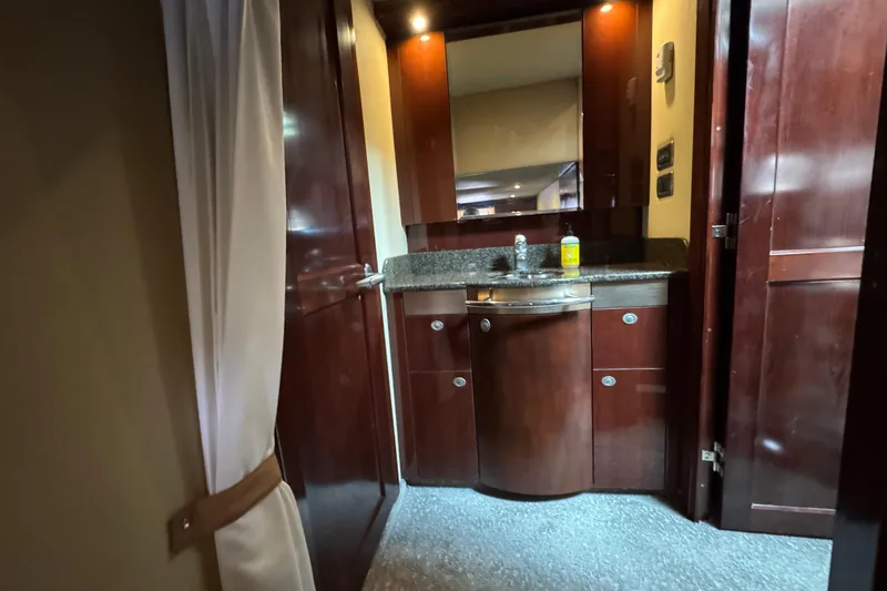 Slide: The Image of Luxurious bathroom interior of 2007 Sea Ray 48 Sundancer yacht with wooden cabinetry. - 34