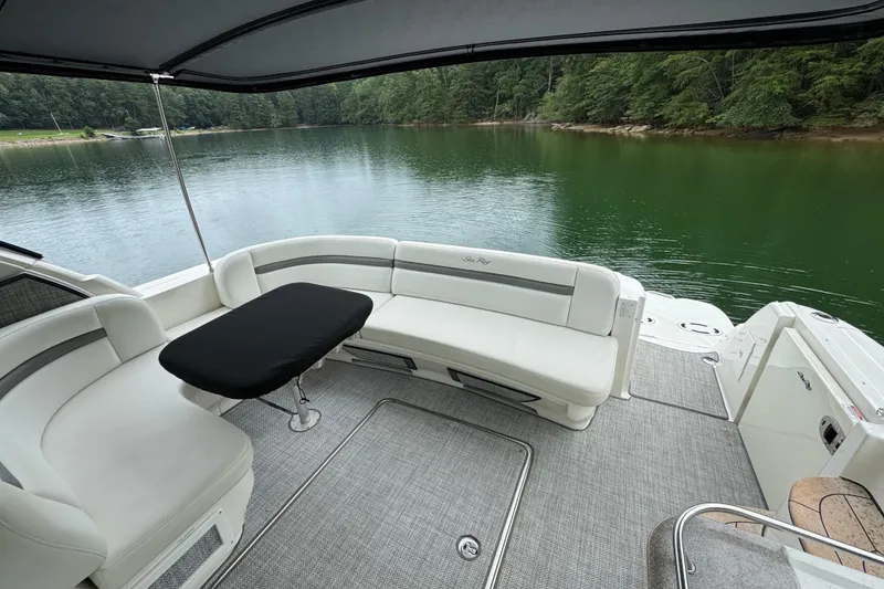 Slide: The Image of 2007 Sea Ray 48 Sundancer yacht with elegant seating, docked on a serene lake. - 40
