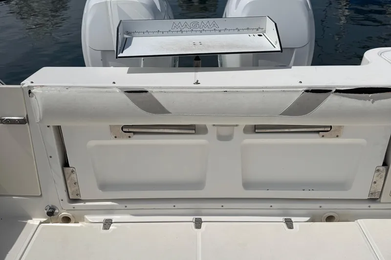 Slide: The Image of 2005 Boston Whaler 305 Conquest boat deck with Magma grill and storage compartments. - 26