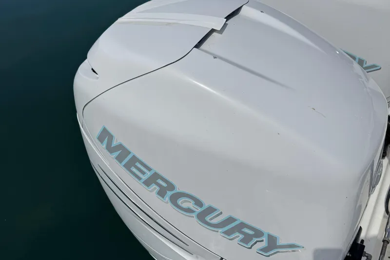 Slide: The Image of 2005 Boston Whaler 305 Conquest with Mercury outboard engine, close-up view. - 30