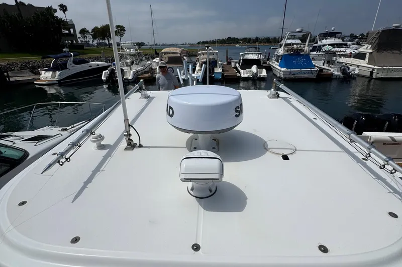 Slide: The Image of 2005 Boston Whaler 305 Conquest boat docked at marina, view from deck. - 33