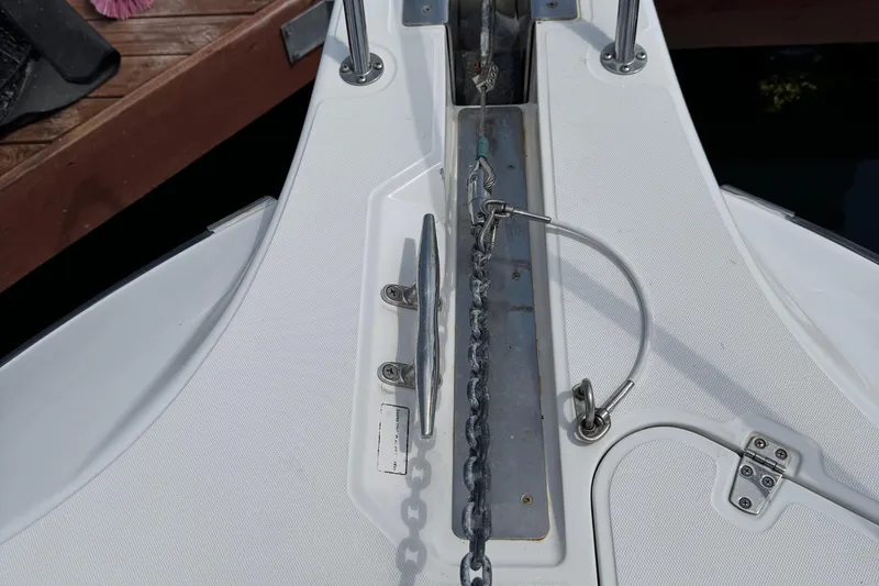 Slide: The Image of 2005 Boston Whaler 305 Conquest anchor chain and deck detail. - 34