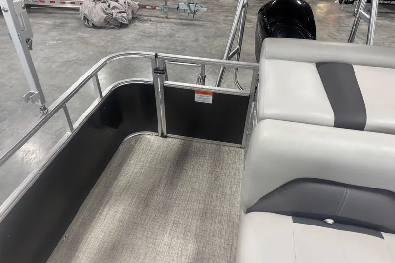 Slide: The Image of 2022 Landau Island Breeze 252 pontoon boat interior with seating and railing. - 9