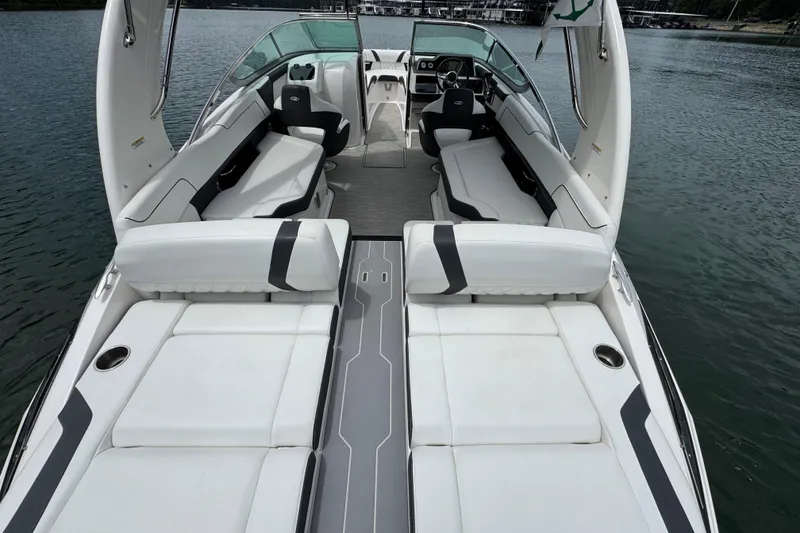 Slide: The Image of 2018 Regal 2500 Bowrider boat with spacious seating on calm water. - 13