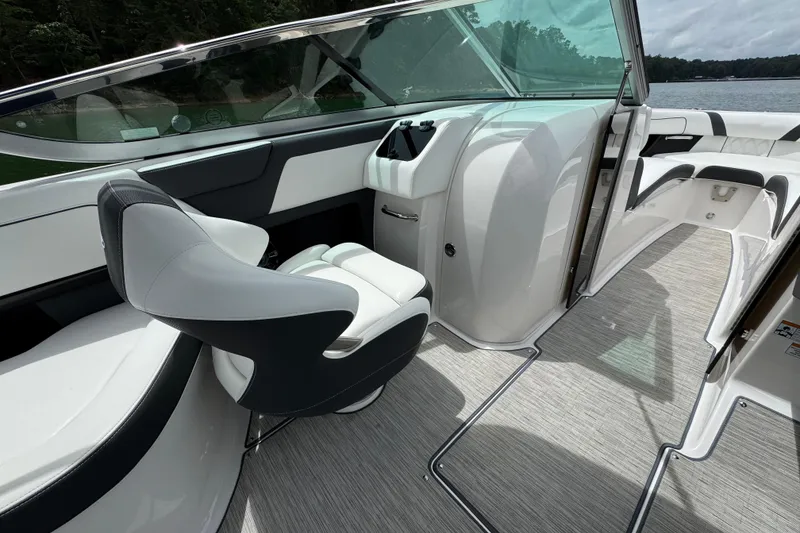 Slide: The Image of 2018 Regal 2500 Bowrider interior with sleek seating and modern design on a sunny day. - 17