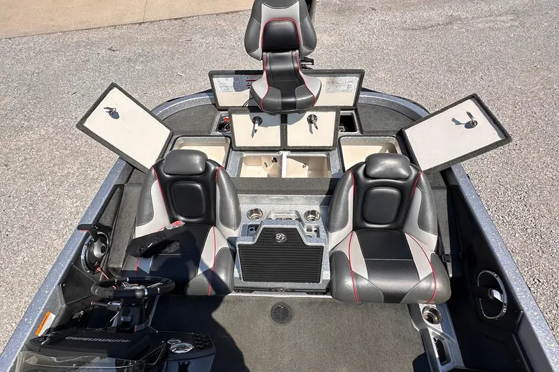 Slide: The Image of 2017 Ranger Z519 boat interior with open storage compartments and seating. - 11