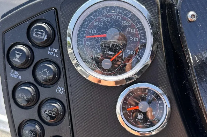 Slide: The Image of Dashboard of a 2017 Ranger Z519 boat with gauges and control buttons. - 14