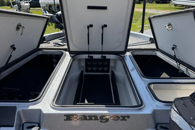 Slide: The Image of 2017 Ranger Z519 boat storage compartments open, showcasing spacious interior design. - 18
