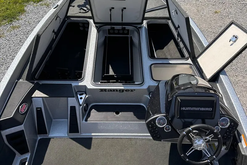 Slide: The Image of 2017 Ranger Z519 boat interior with open storage compartments and Humminbird navigation system. - 19