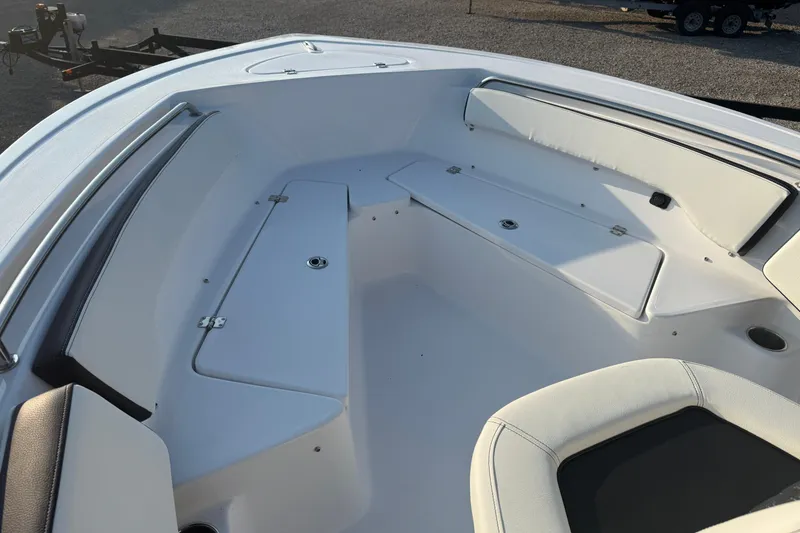 Slide: The Image of 2025 Tidewater 198 CC Adventure boat interior with white seating and storage compartments. - 8