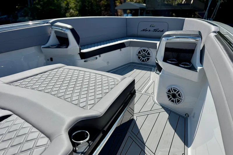 Slide: The Image of 2026 Nor-Tech 390 Sport Center Console with luxurious seating and modern design. - 13