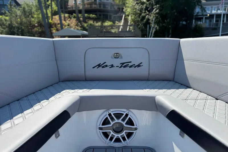 Slide: The Image of 2026 Nor-Tech 390 Sport Center Console interior with speaker and logo detail. - 14