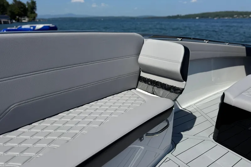 Slide: The Image of 2026 Nor-Tech 390 Sport Center Console boat interior with sleek seating design. - 16
