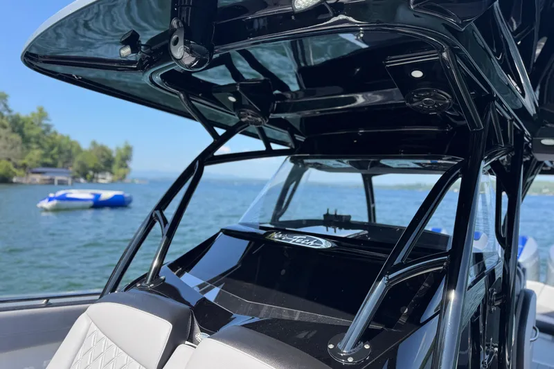 Slide: The Image of 2026 Nor-Tech 390 Sport Center Console boat on a scenic lake. - 18