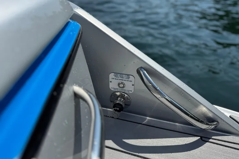 Slide: The Image of Close-up of 2026 Nor-Tech 390 Sport Center Console boat detail by the water. - 23