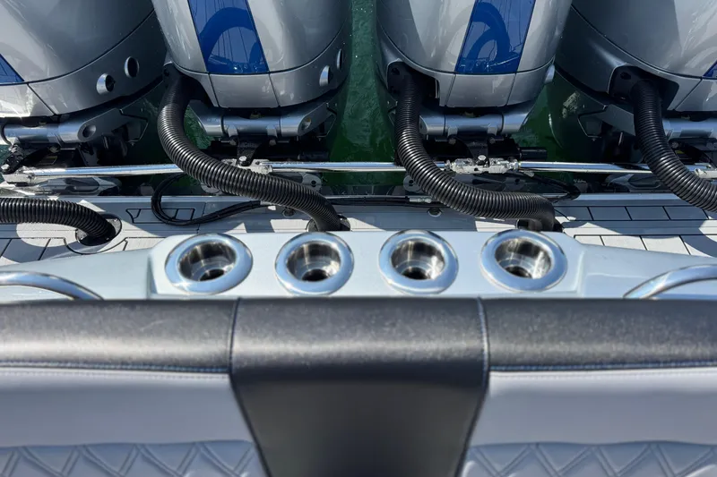 Slide: The Image of 2026 Nor-Tech 390 Sport Center Console with powerful outboard engines and sleek design. - 24