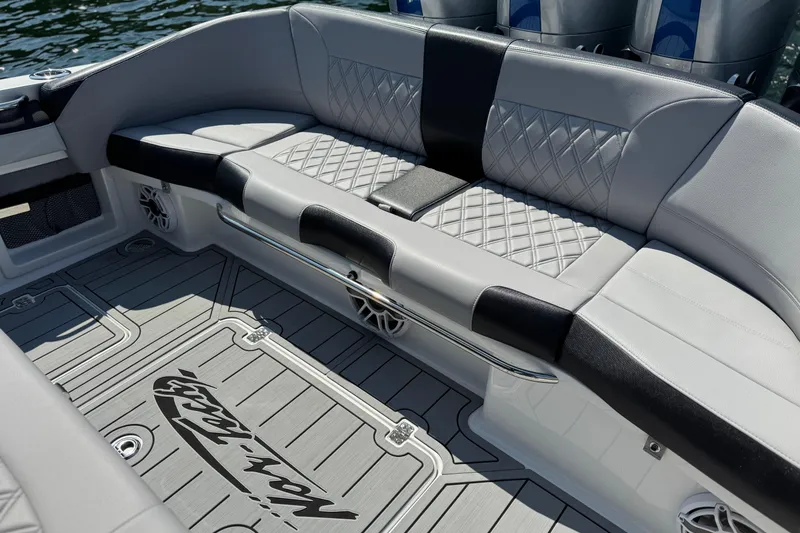 Slide: The Image of 2026 Nor-Tech 390 Sport Center Console with luxurious seating and stylish deck design. - 25