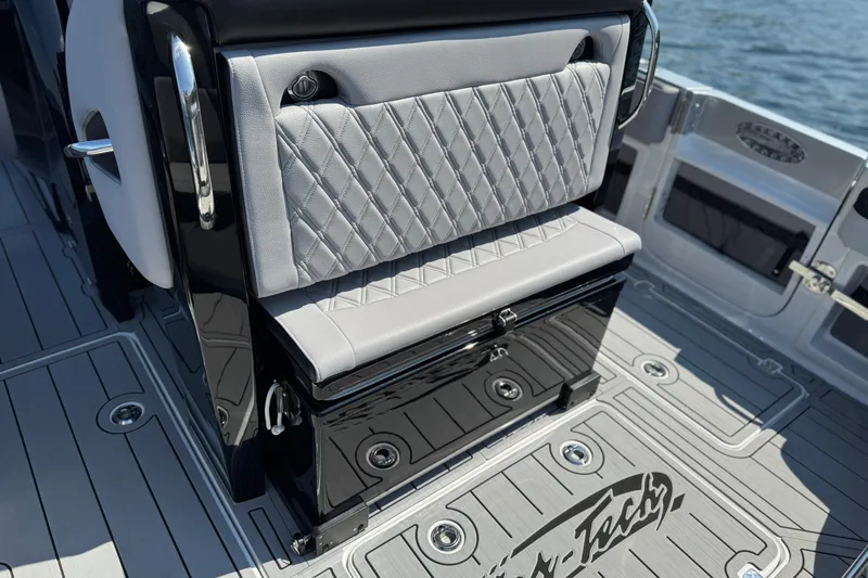 Slide: The Image of 2026 Nor-Tech 390 Sport Center Console with luxurious seating and sleek design on deck. - 26