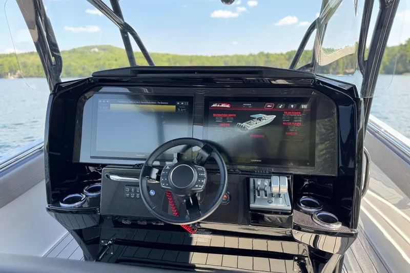 Slide: The Image of 2026 Nor-Tech 390 Sport Center Console dashboard with advanced navigation screens. - 27