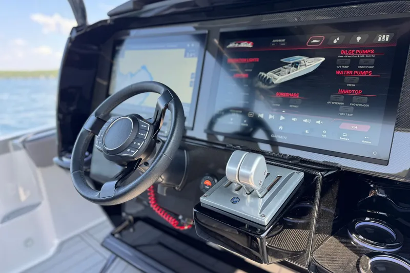 Slide: The Image of Steering console of 2026 Nor-Tech 390 Sport Center Console with advanced touchscreen controls. - 28