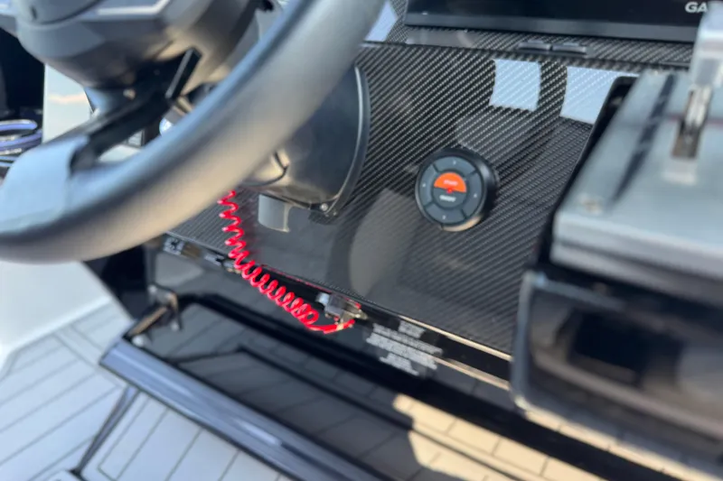 Slide: The Image of Steering wheel and control panel of 2026 Nor-Tech 390 Sport Center Console boat. - 29