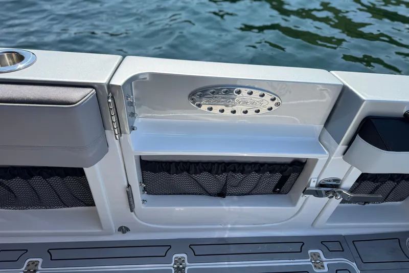Slide: The Image of 2026 Nor-Tech 390 Sport Center Console boat interior detail with storage compartments. - 33