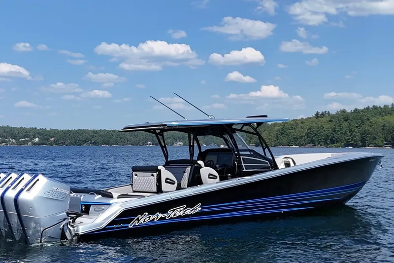 Slide: The Image of 2026 Nor-Tech 390 Sport Center Console boat on a sunny lake. - 4