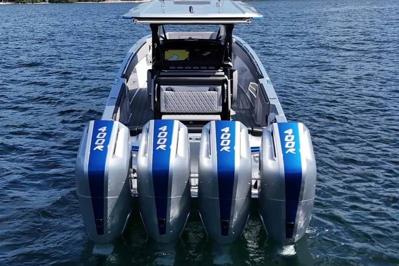 Slide: The Image of 2026 Nor-Tech 390 Sport Center Console with quad 400R engines on water. - 5