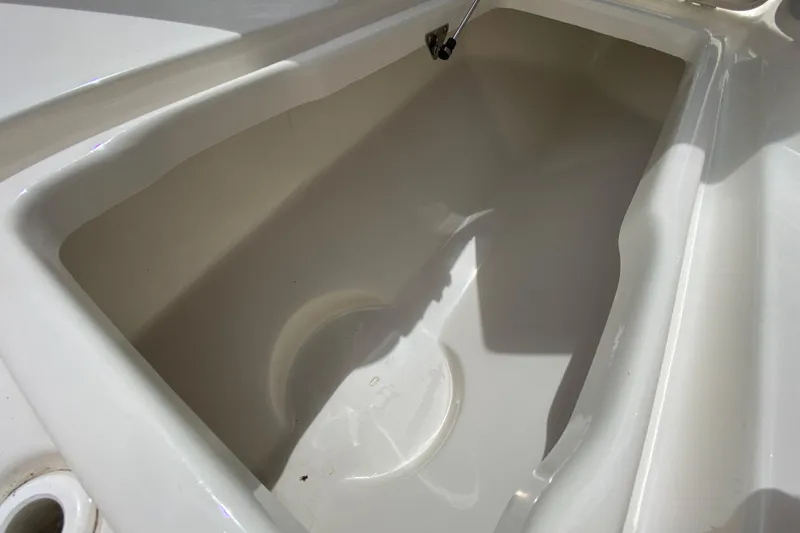 Slide: The Image of 2023 Key West 239 FS boat storage compartment, open and empty. - 100