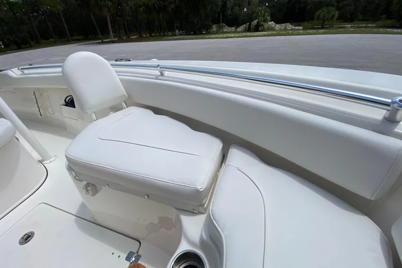 Slide: The Image of 2023 Key West 239 FS boat interior with white seating and stainless steel railing. - 111