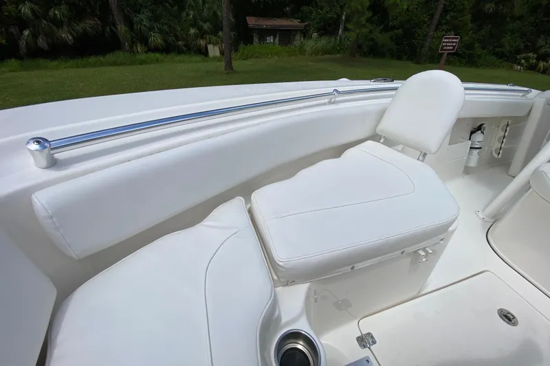 Slide: The Image of 2023 Key West 239 FS boat interior with white seating and stainless steel rail. - 112