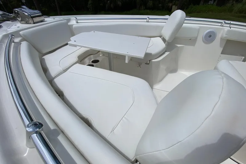 Slide: The Image of 2023 Key West 239 FS boat interior with white seating and table. - 120